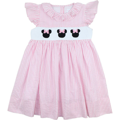 Pink and white striped dress with cartoon character design on a white background