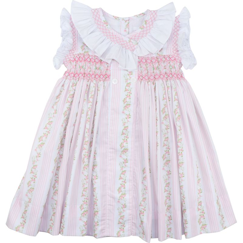 Pink floral dress with ruffled collar on a white background