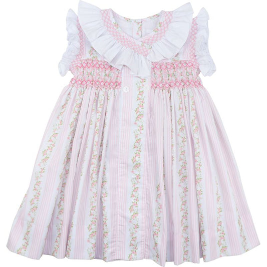 Pink floral dress with ruffled collar on a white background