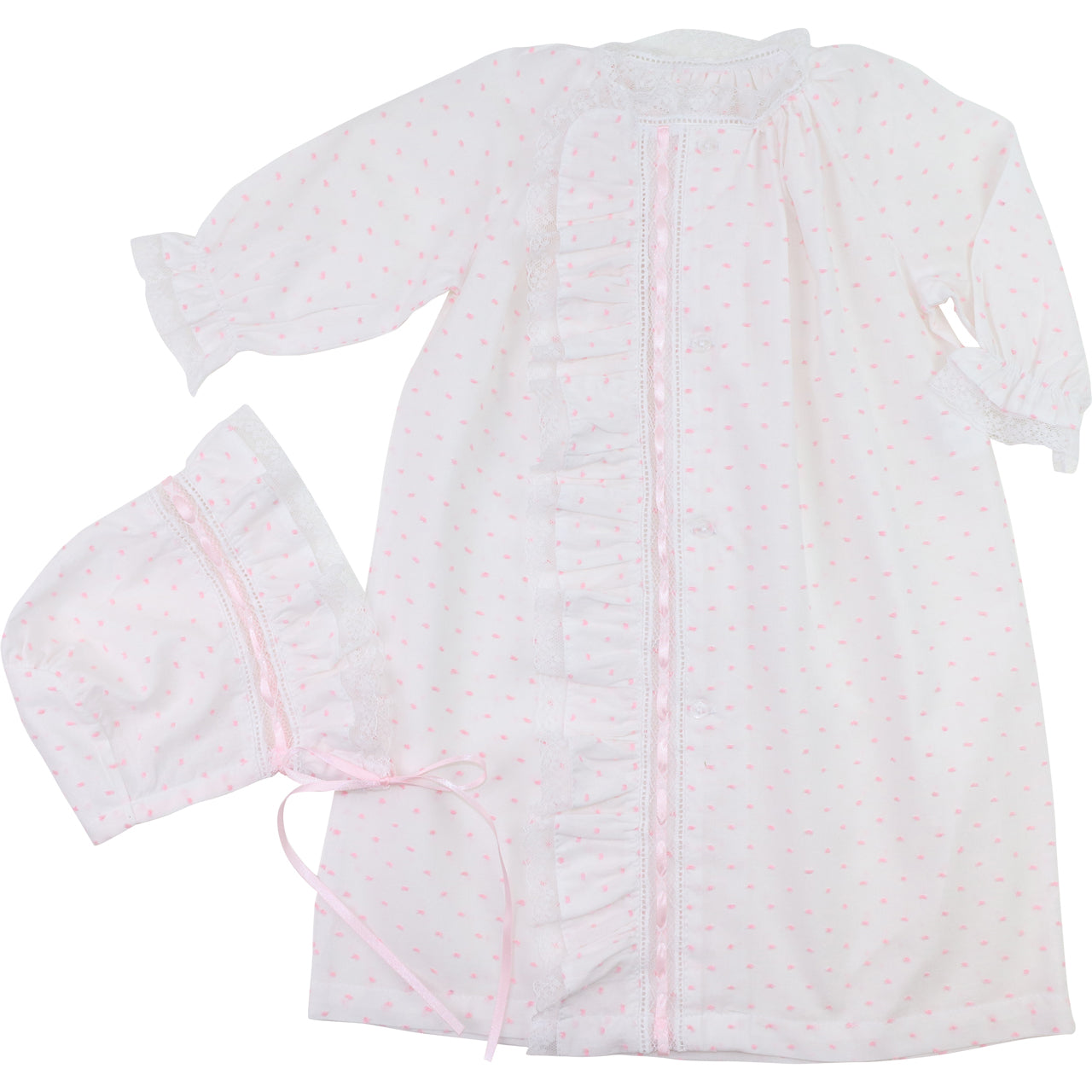 pink swiss dot baby outfit with pink accents on a white background