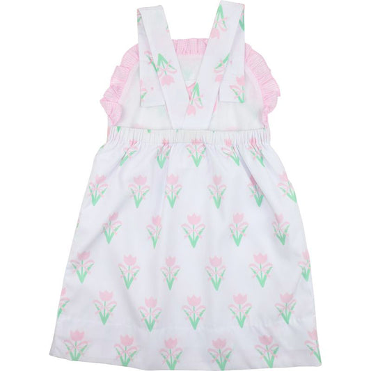 White dress with pink floral pattern on a white background