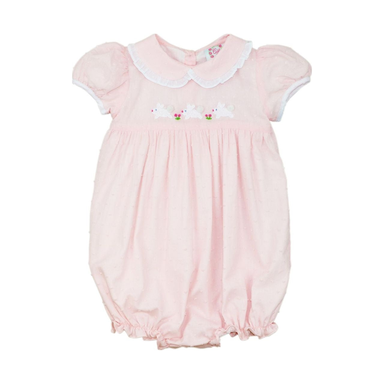 Pink swiss dot baby bubble with white collar and floral embroidery on a white background