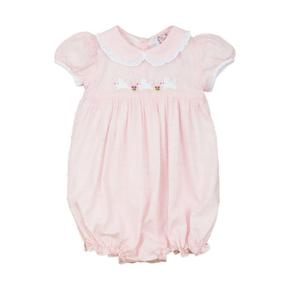 Pink swiss dot baby bubble with white collar and floral embroidery on a white background