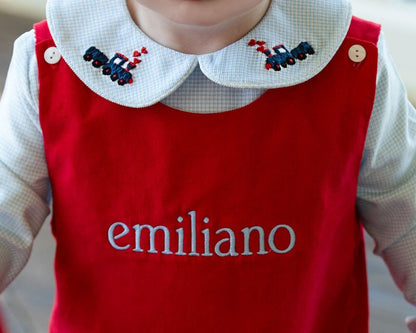 Red long romper with embroidered name 'emiliano' on the collar