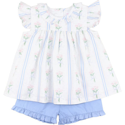 Children's outfit with floral-patterned top and blue shorts on a white background