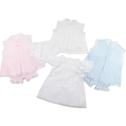 Set of three baby dresses in pink, white, and blue on a white background