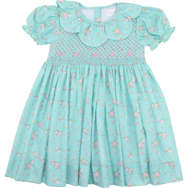 Light green dress with floral pattern on a white background