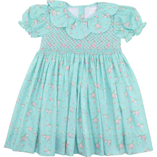 Light green dress with floral pattern on a white background