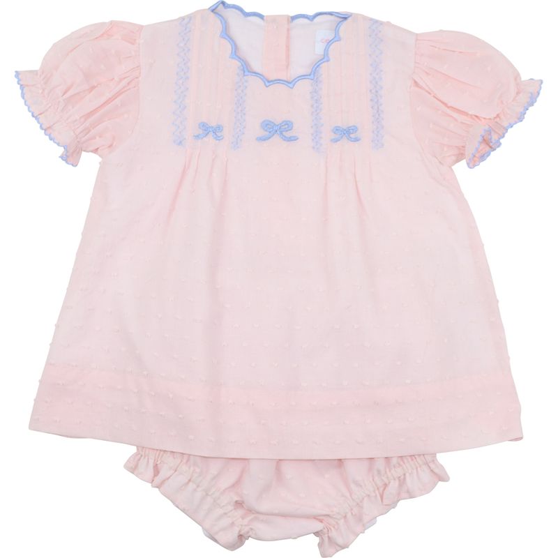 Pink baby outfit with ruffled top and bloomers on a white background