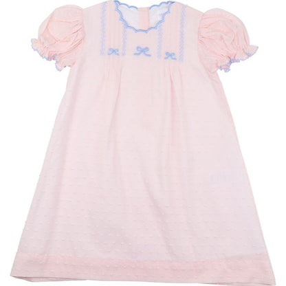 Pink baby dress with ruffled sleeves on a white background