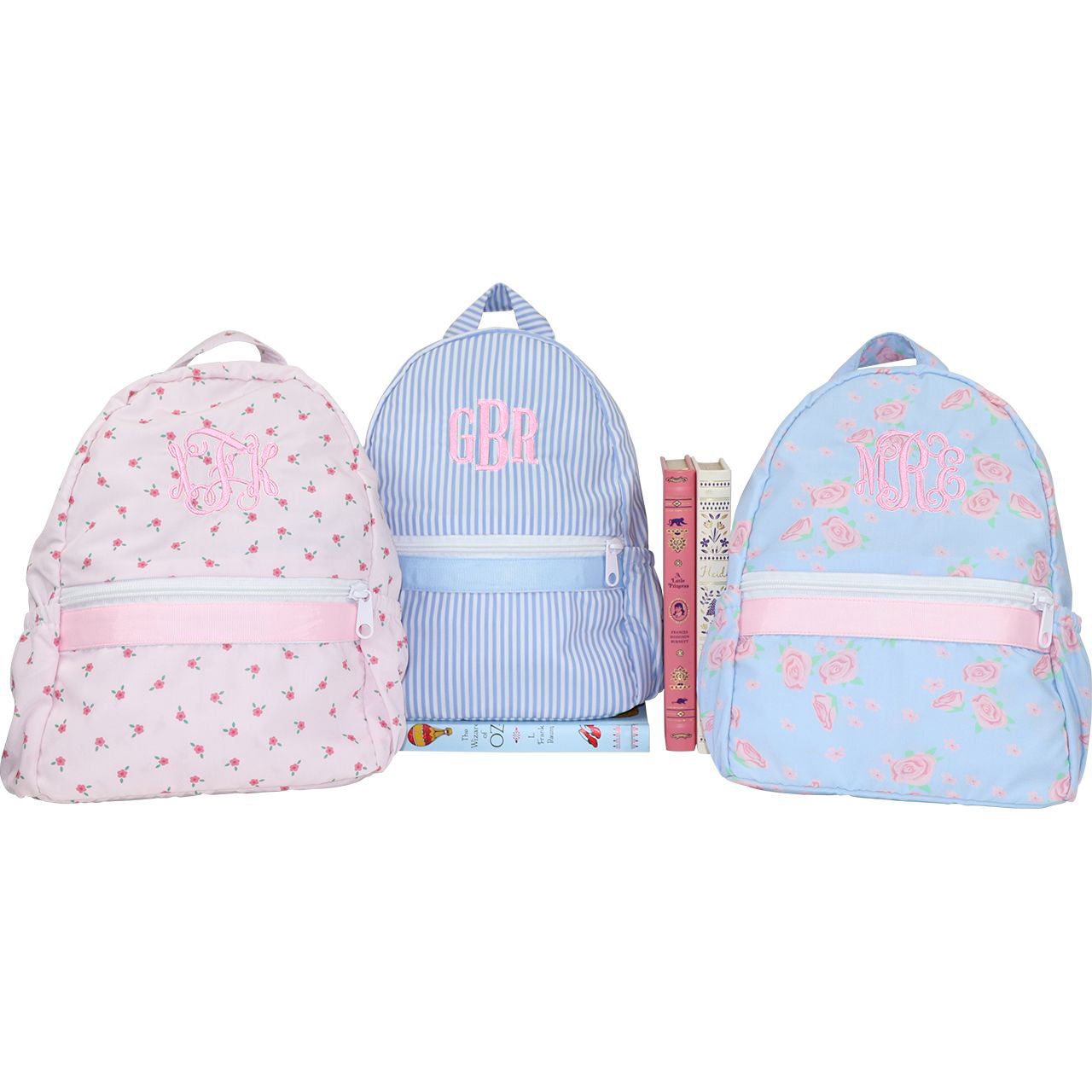 Three backpacks with monograms