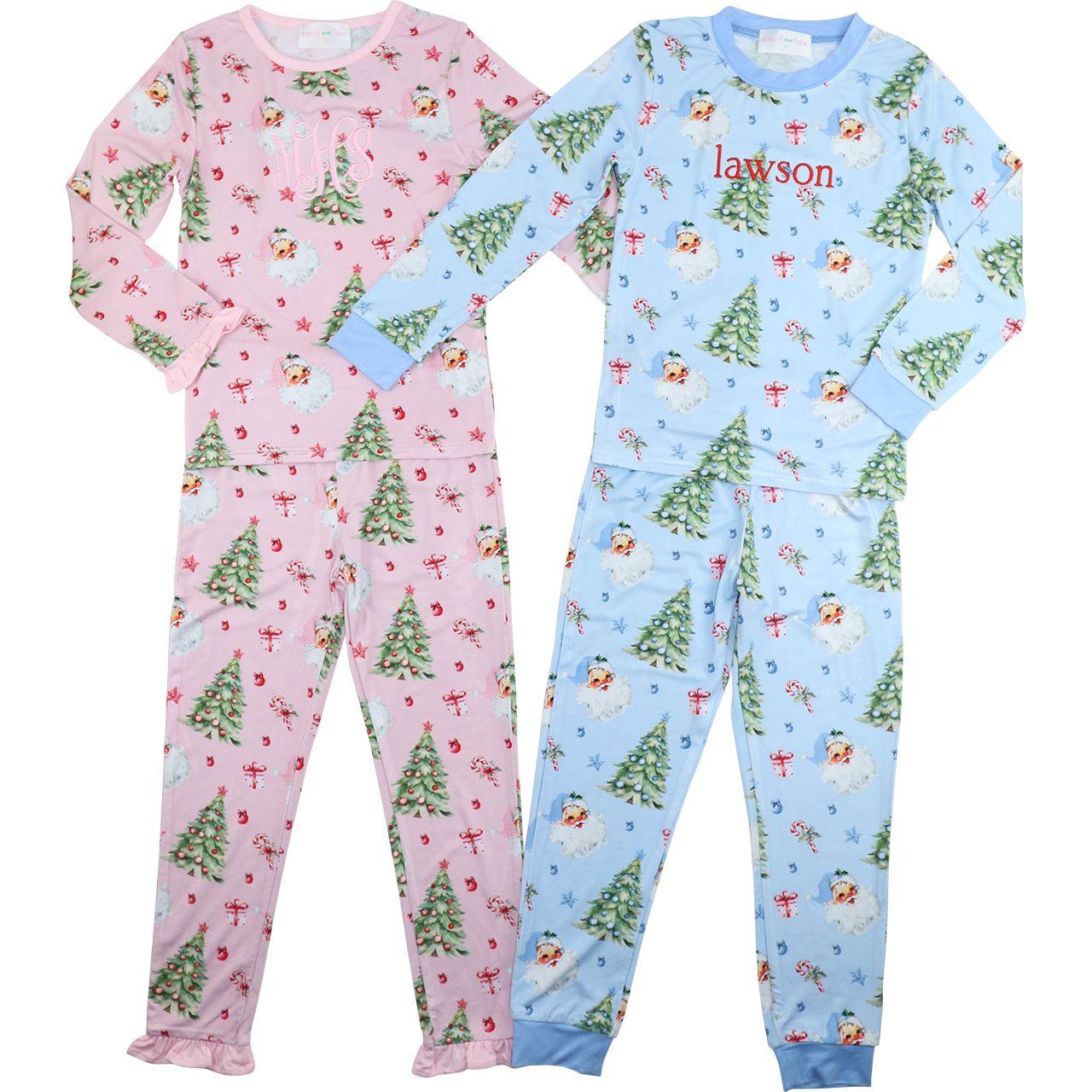 Two children's pajama sets, one pink with Christmas tree pattern and one blue with snowman pattern, on a white background.