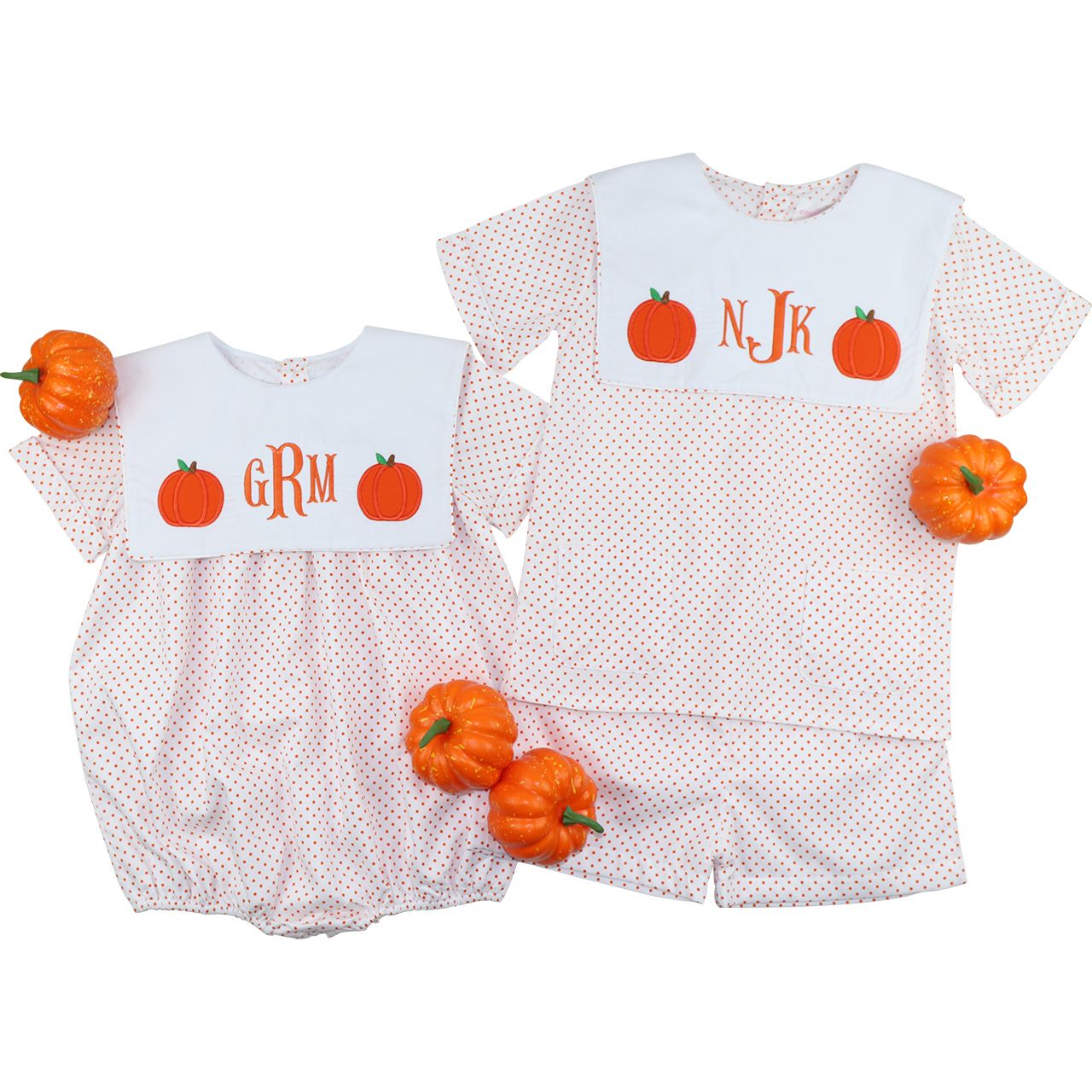 Two matching boy outfits with pumpkin designs and monograms on a white background