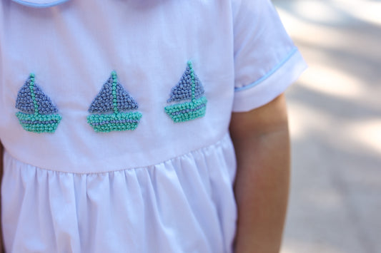 White bubble with detailed crocheted sailboat stitching