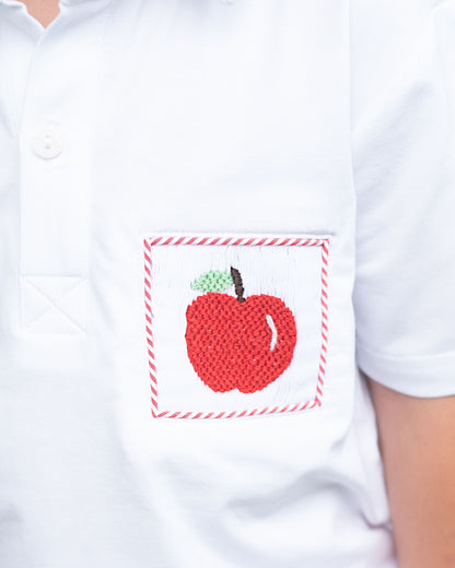 White shirt with a red apple design on a white background