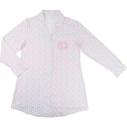 White shirt with pink floral pattern on a white background