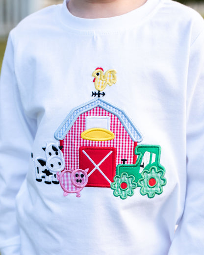 White sweatshirt with farm-themed appliqué including a barn, animals, and a train.