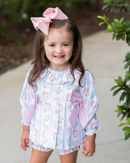 Young girl wearing Pink And Blue Floral Bouquet Diaper Set
