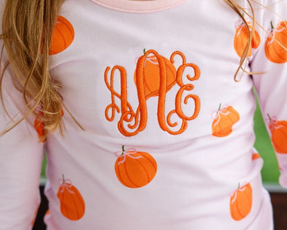 girl pajama set with orange pumpkins and monogram "aAe" 