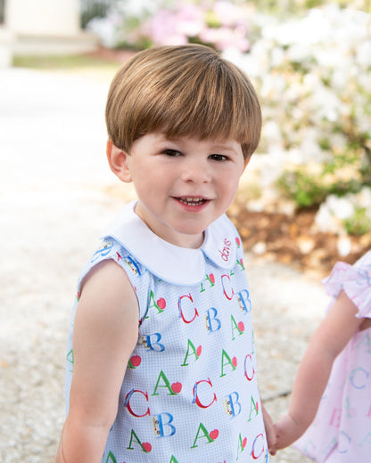 little boy wearing a back to school bubble