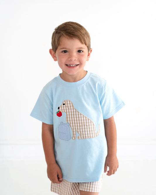 little boy wearing a back to school short set with a puppy and apple