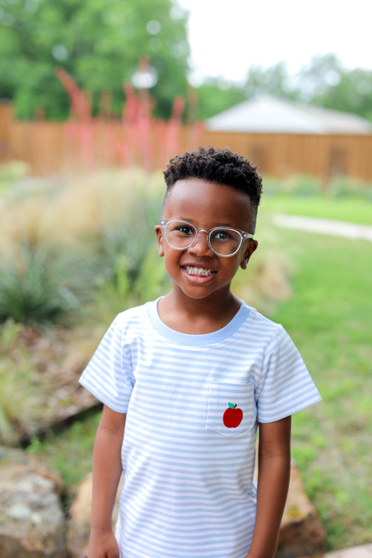 little boy wearing a blue striped apple shirt