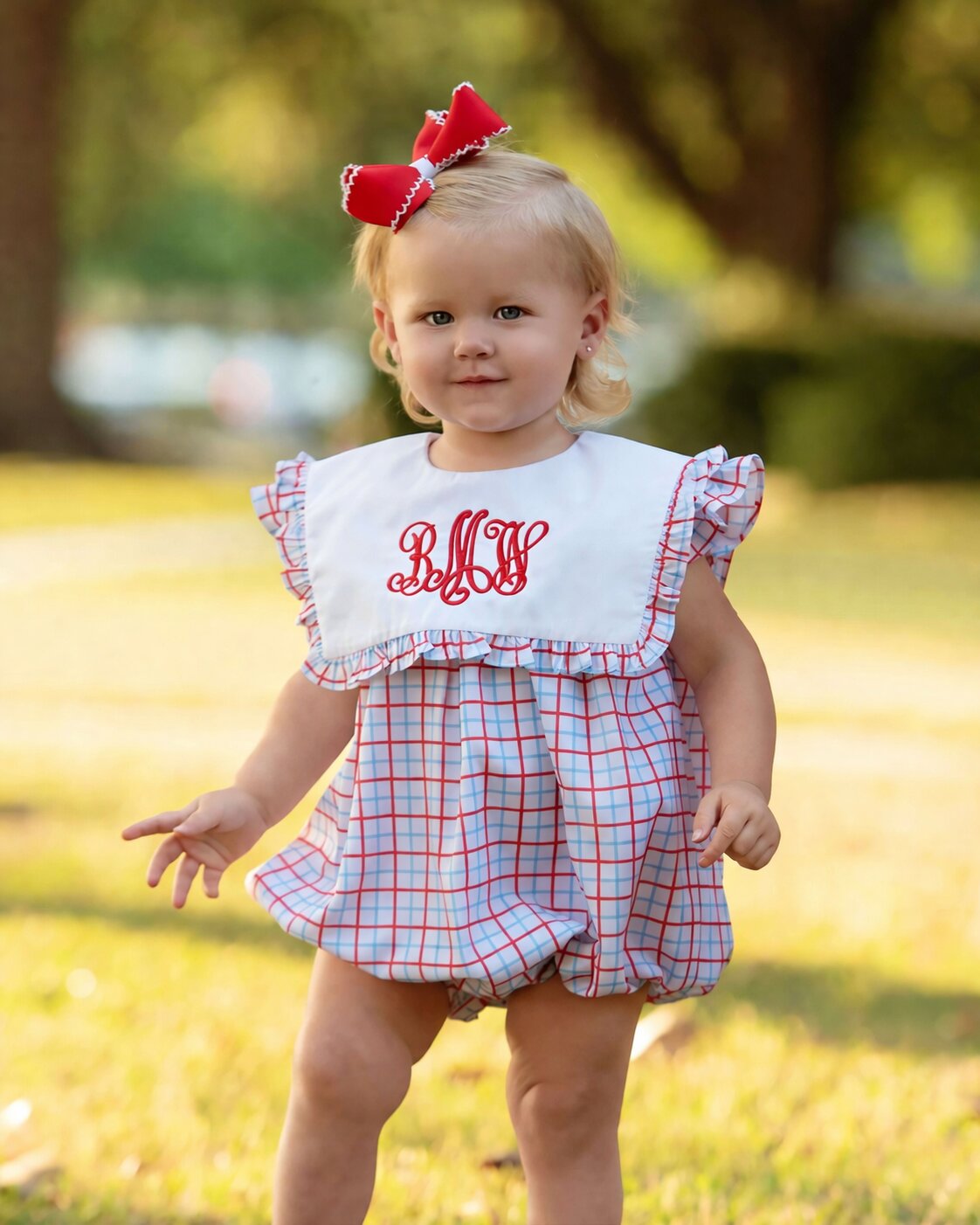 little girl wearing a red and blue bubble