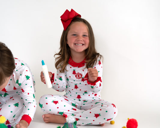 Personalized Christmas tree ruffle pajamas for girls with red trim, monogram detail, and holiday print