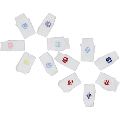Set of white knee-high socks with colorful monograms on a white background