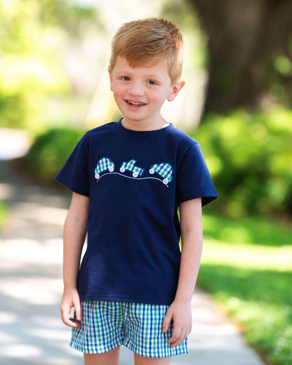 Young Boy Wearing A Green And Navy Short Set With Three Applique Cars On the Front