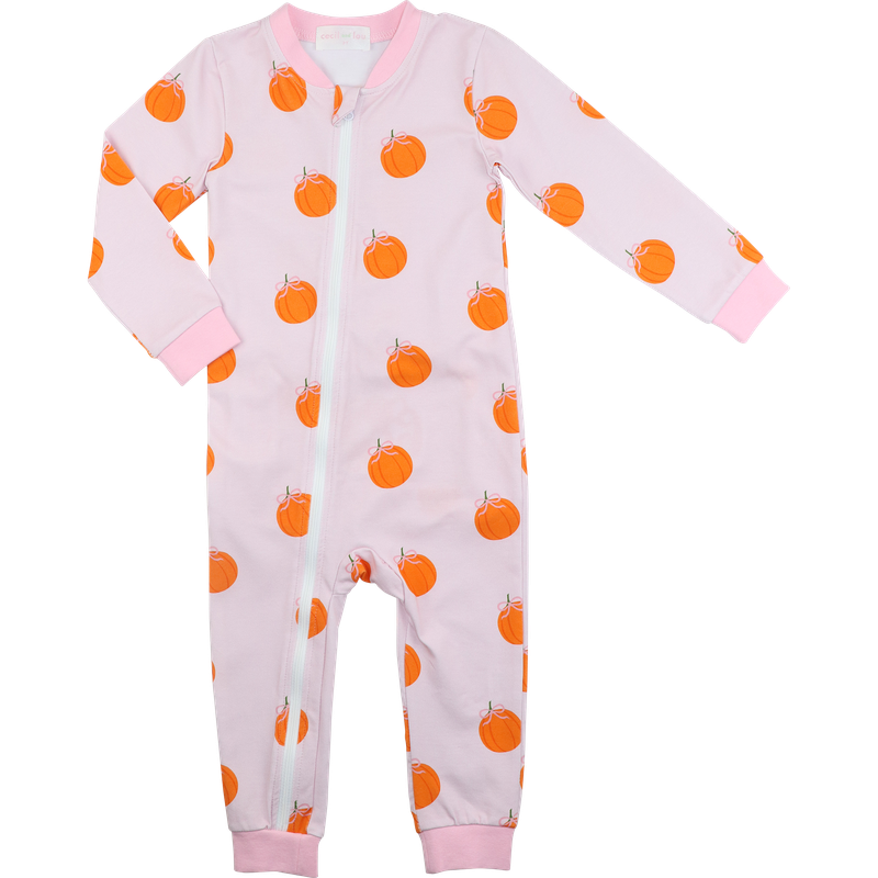zipper pajama with orange pumpkin pattern on a pink background