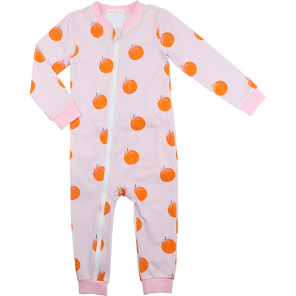 zipper pajama with orange pumpkin pattern on a pink background